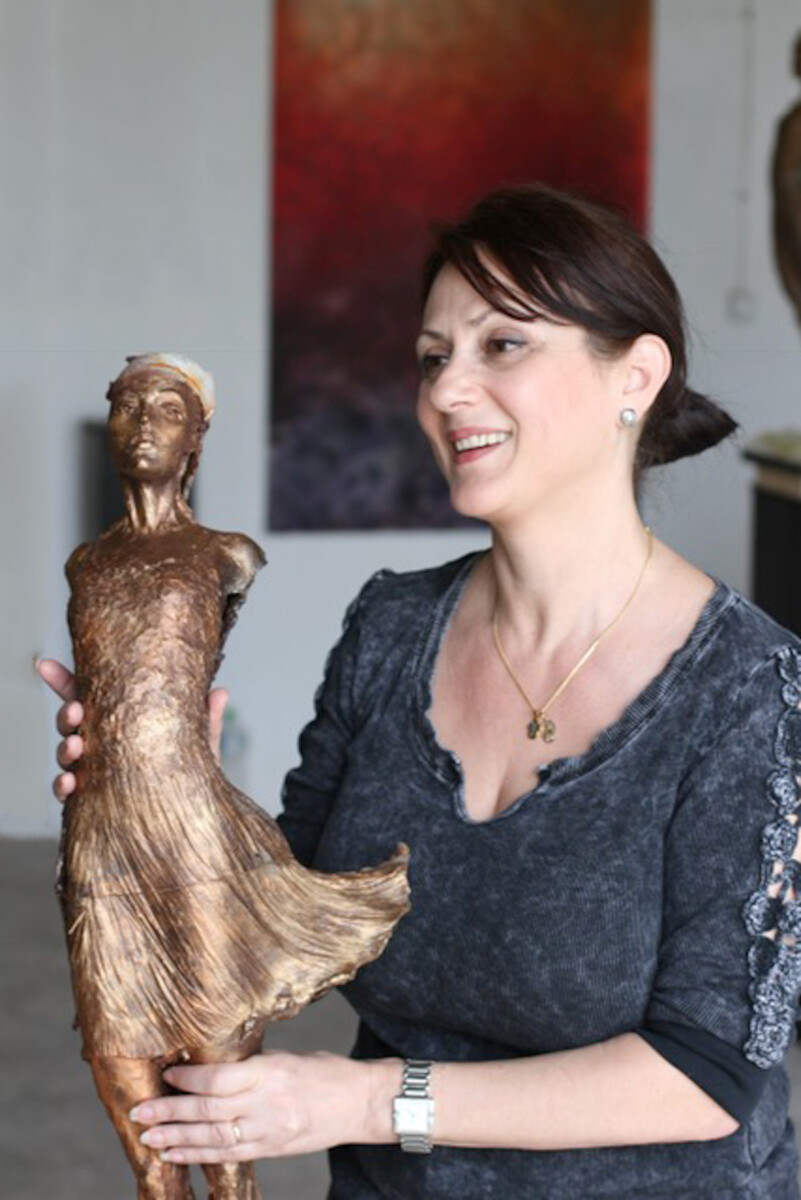 Elena Bond with dancer sculpture